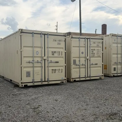 Cream shipping containers lined up in inventory