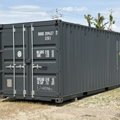 Gray shipping container with door hardware and side view